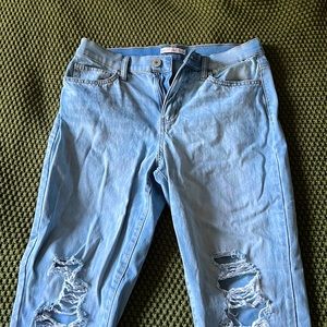 SO l, light wash high rise ripped mom jean.